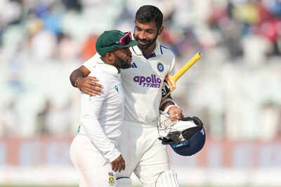Bumrah and bavuma.jpg
