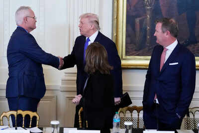 Trump and ceo of exxonmobil darren woods.jpg
