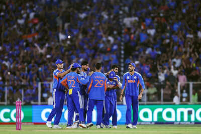 Ahmedabad mar 08 ani india39s varun chakravarthy and teammates celebrate the .jpg