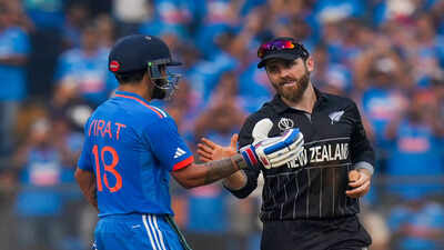 Mumbai india39s virat kohli being congratulated by new zealands captain kane wi.jpg