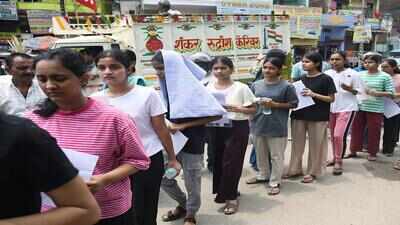 Patna jun 21 ani aspirants wait in a queue outside the examination centre to.jpg