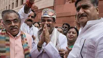 Ndamps welcomed dharmendra pradhan in parliament photo credit pti.jpg