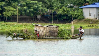 People wade through a flood affected area.jpg