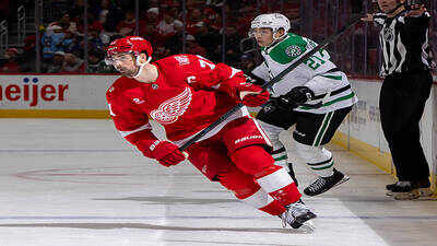 Nhl dylan larkin 71 of the detroit red wings follows the play in front of jason robertson 21 of the.jpeg