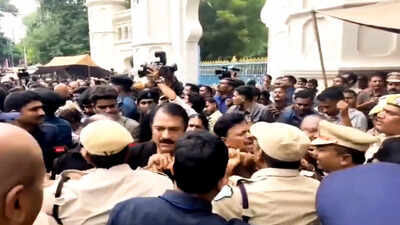 Police personnel push back bharat rashtra samithi brs leaders during a scuffle while detaining them.jpeg