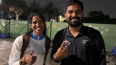 Vithya ramraj with her coach nehpal singh.jpg