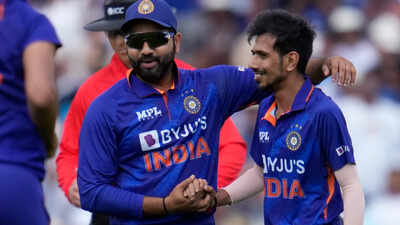 Indias yuzvendra chahal right celebrates with india captain rohit sharma afte.jpg