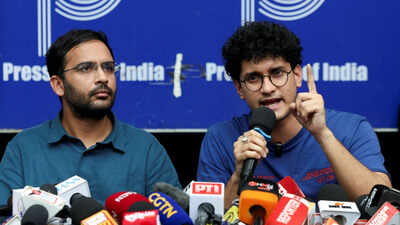 Saurav das chief spokesperson of the cockroach janta party cjp speaks next to ashutosh ranka co conv.jpeg