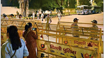 Security personnel stand guard near barricades at janpath ahead of the oct 10 protest.jpg