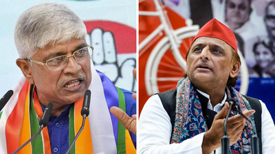 Up congress in charge rajendra pal gautam and sp chief akhilesh yadav.jpg